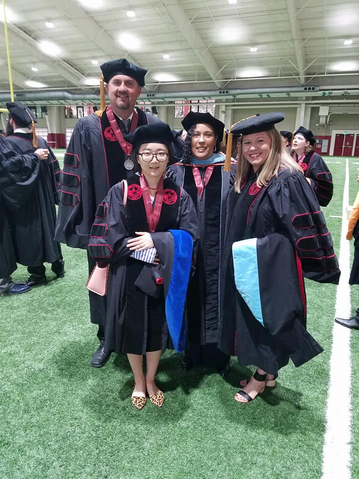 Dr. Mitchell & 3 Graduates